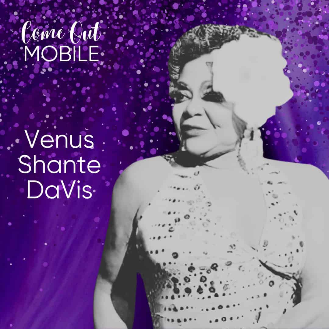 A person in a sparkling outfit and large flower headpiece, with text reading "Come Out Mobile" and "Venus Shante DaVis" on a purple, glittery background.