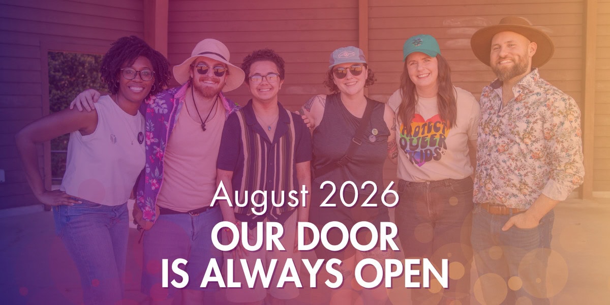 Six people stand smiling together outside a building. Text on the image reads, “August 2026 Our Door Is Always Open.”.