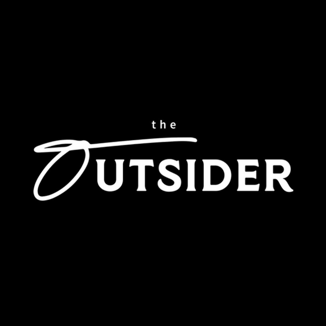 White text on a black background reads "the Outsider," with a stylized "O" at the start of the word "Outsider.